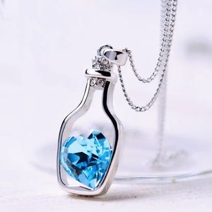 Crystal Blue Heart Pendant Necklace in a silver bottle for W…
